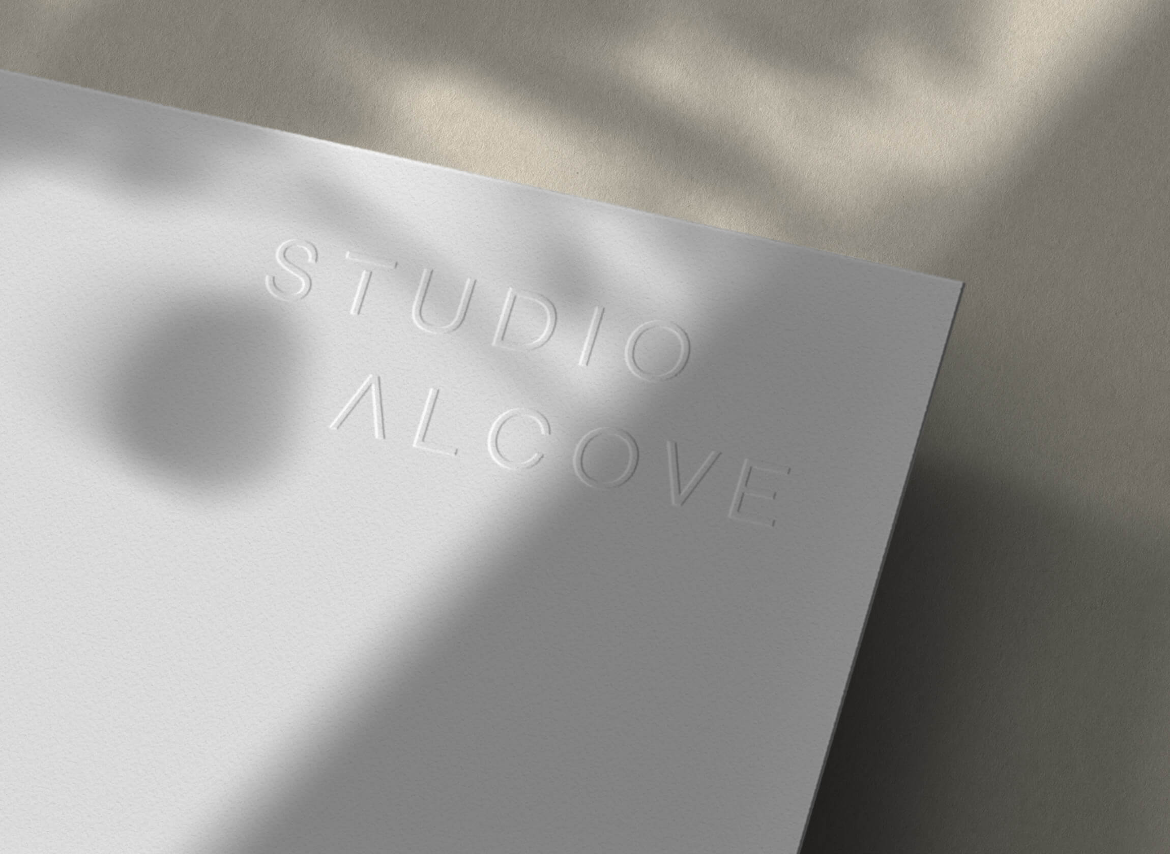 Embossed logo on white stock for luxury interior design brand